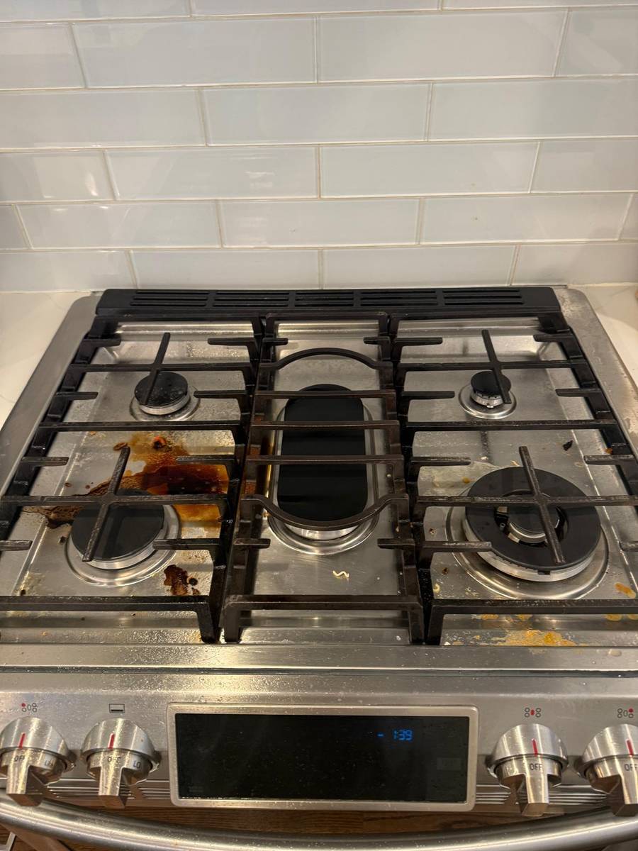Dirty stovetop before BelaClean service